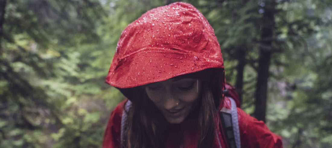 Close-up of rain beading on waterproof outdoor clothing treated with Nikwax